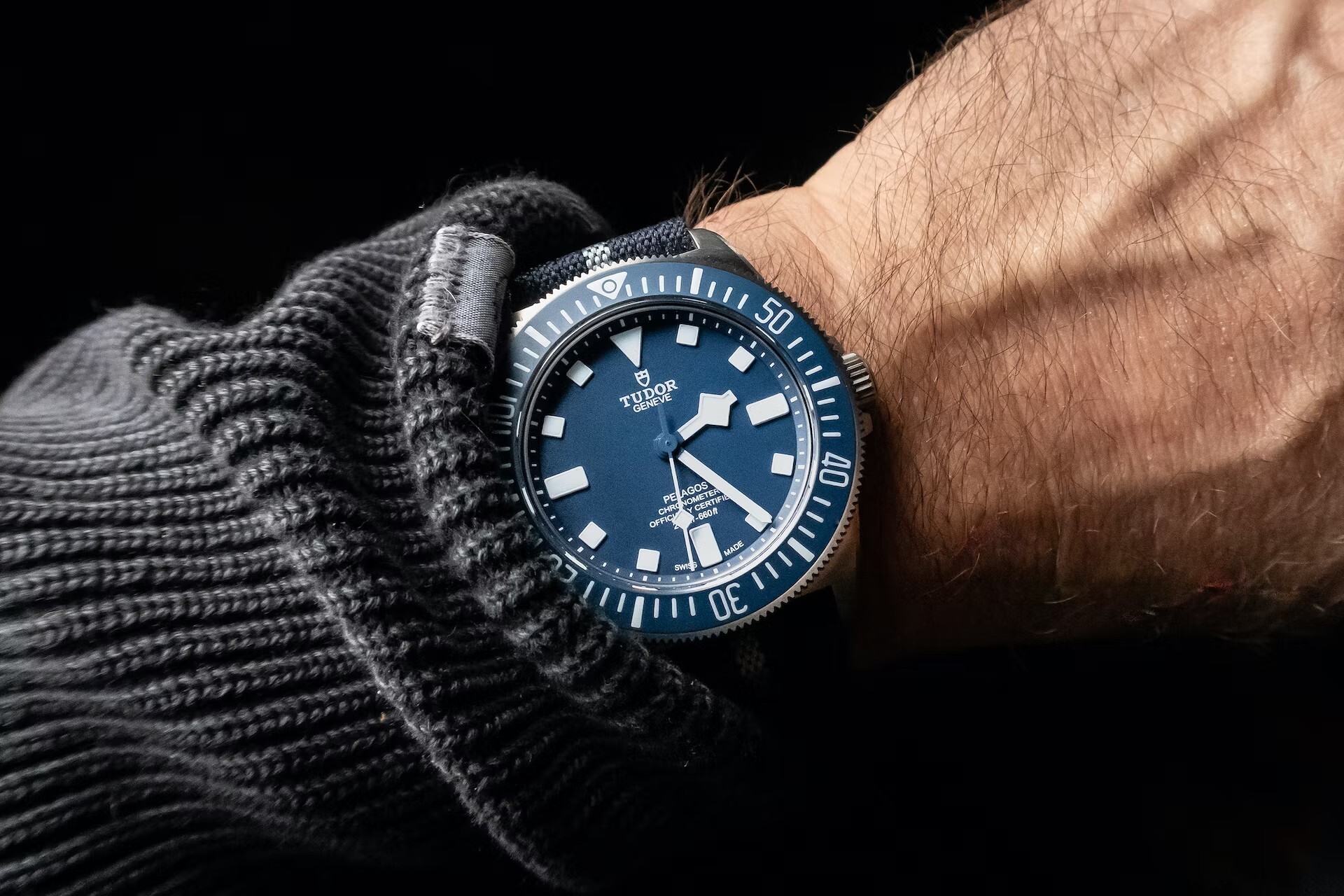 A man wears the Tudor Pelagos FXD.