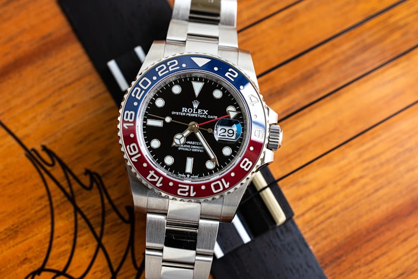 Rolex GMT-Master II Pepsi on a wooden surface