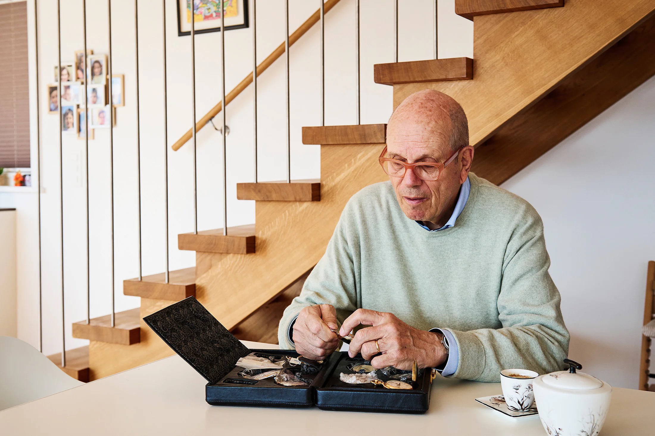 A man looking at a collection of watches
