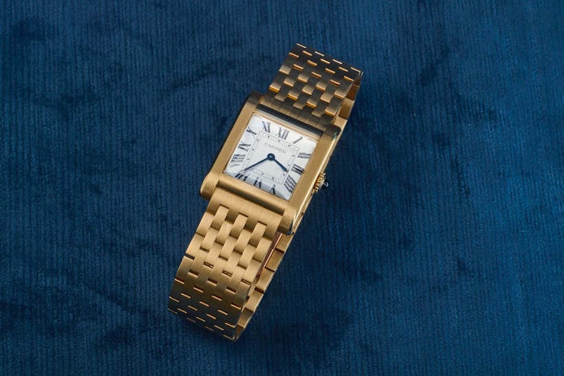 The Cartier Tank Normale sitting on its bracelet