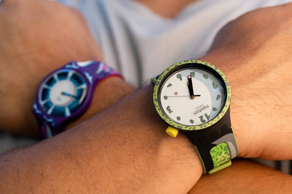 Cell themed watch on wrist