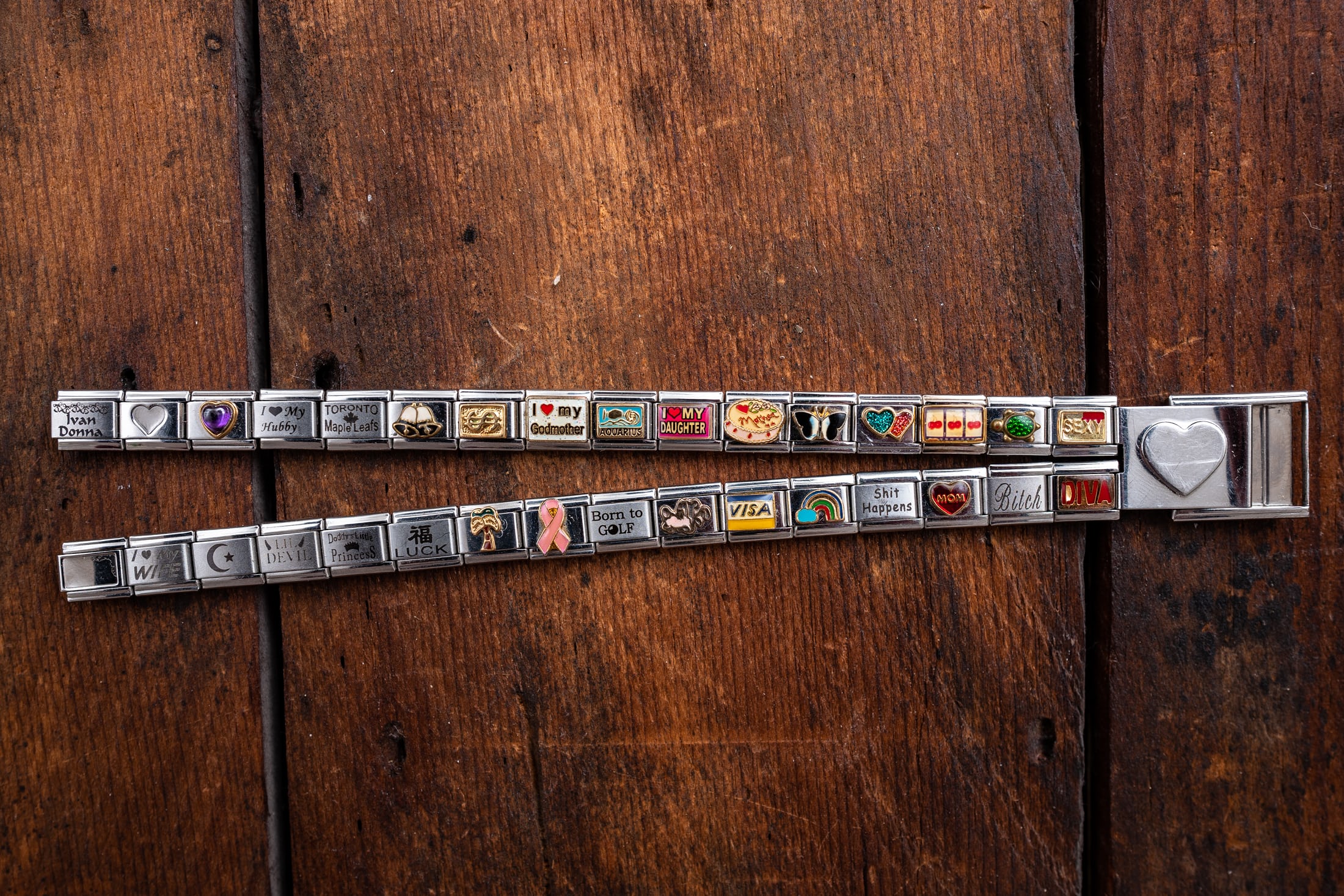 The aforementioned charm bracelet laying on a table. 
