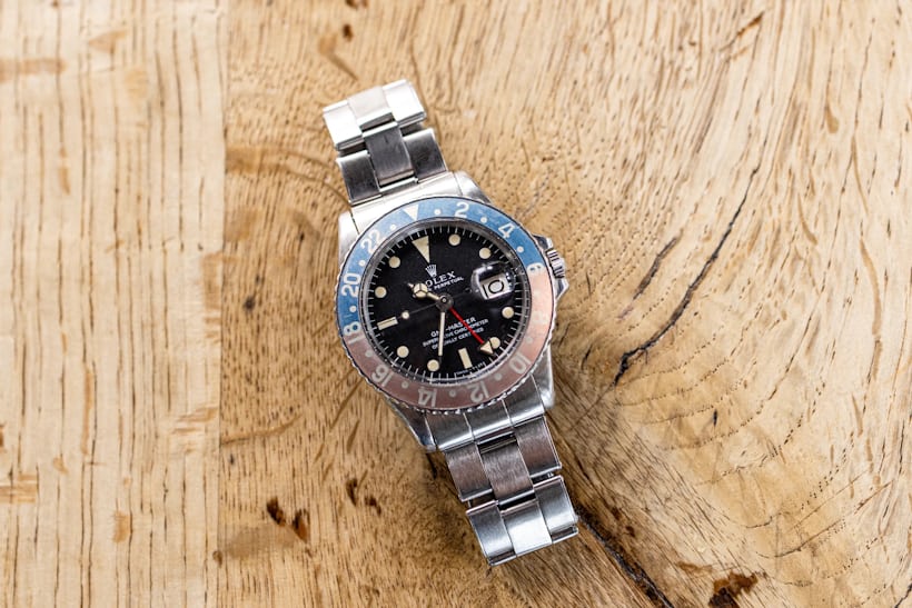 Rolex GMT-Master 1675 on a wooden surface