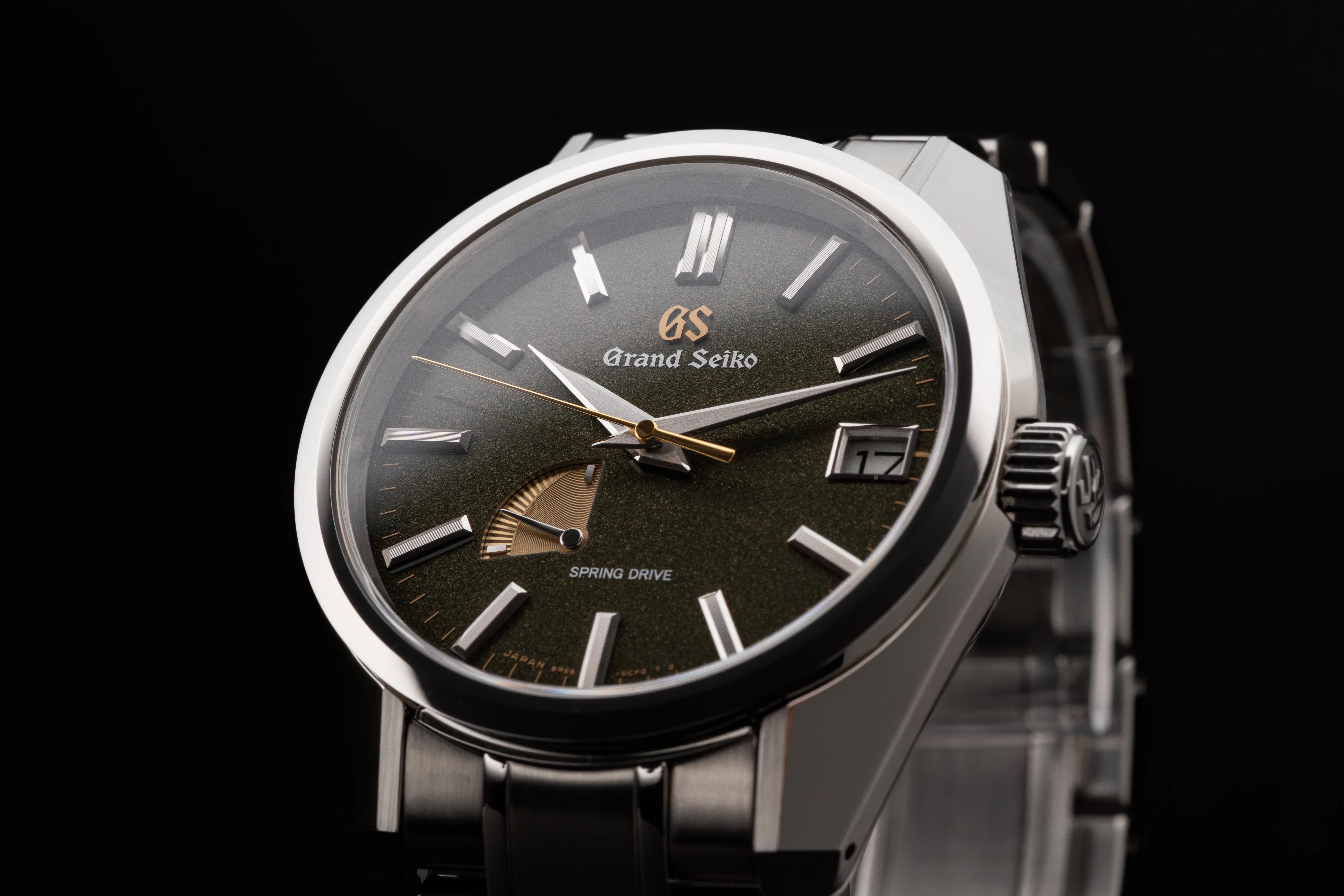 Watch in moody lighting and black background 