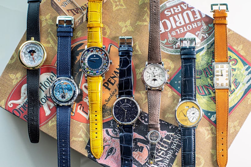 A collection of 7 watches with a range of differently designed and colored dials and straps