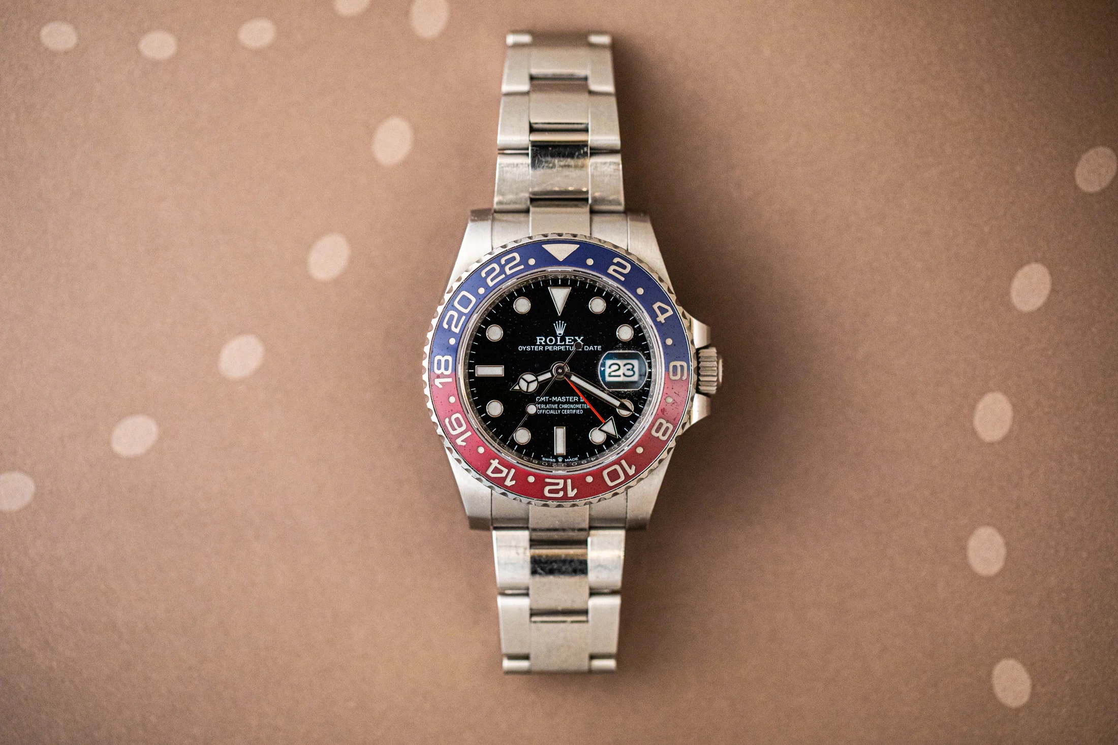 Rolex GMT-Master II Pepsi on a brown background