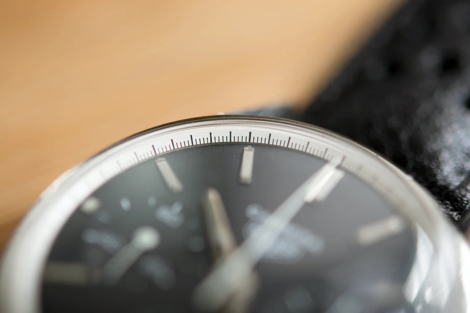 Close up of a Heuer Carrera showing the angled tension ring