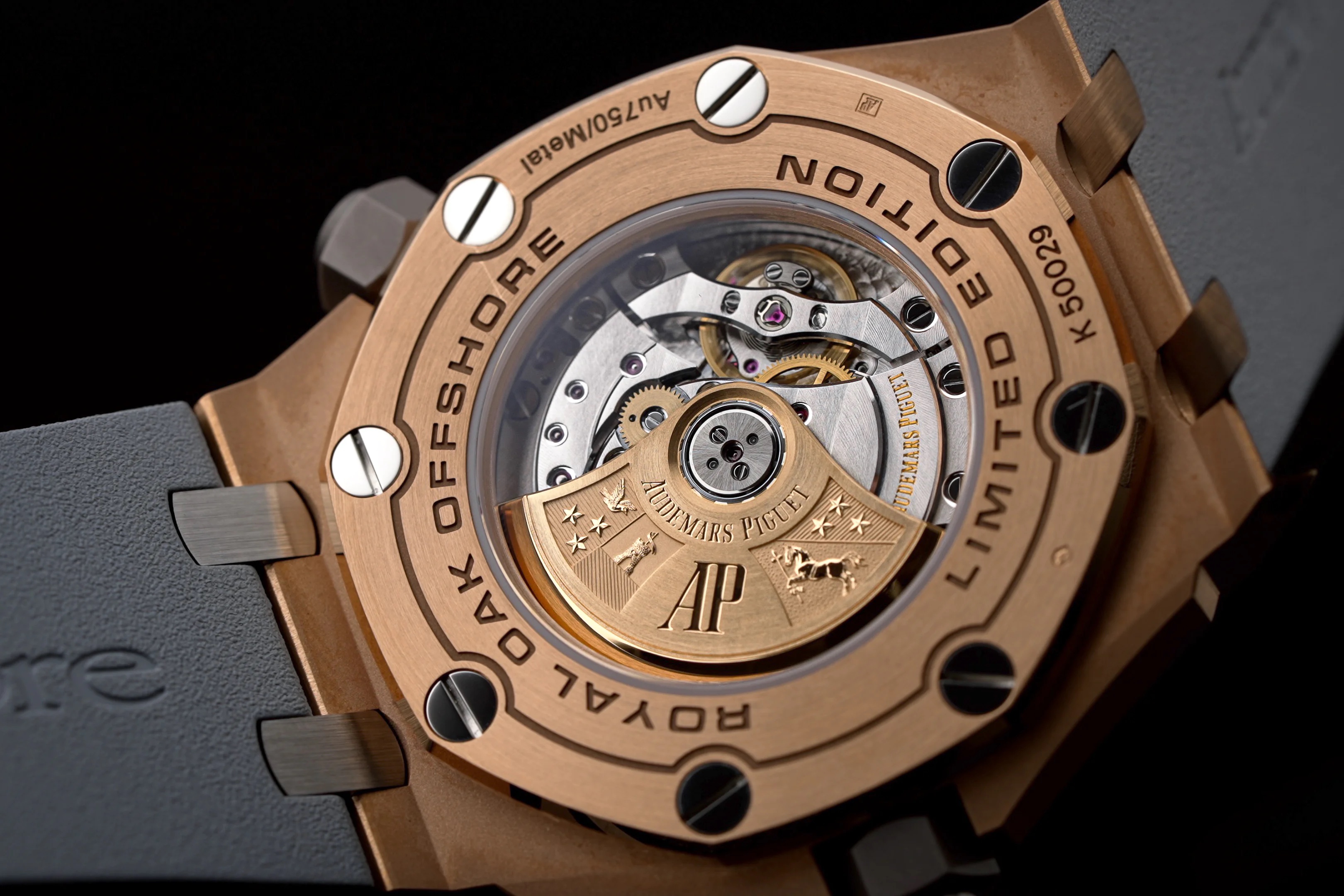 holding up watch to show off case back